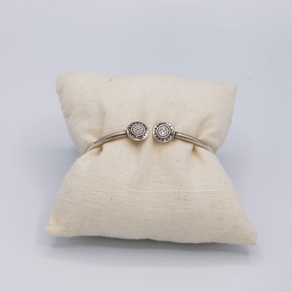 The Pandora Signature Sterling Silver Open Bangle is a stylish and elegant piece - Picture 1 of 3